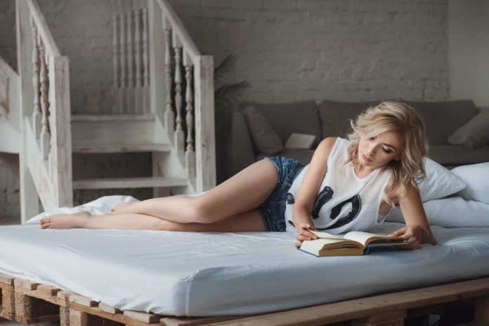 sexy woman reading books photo